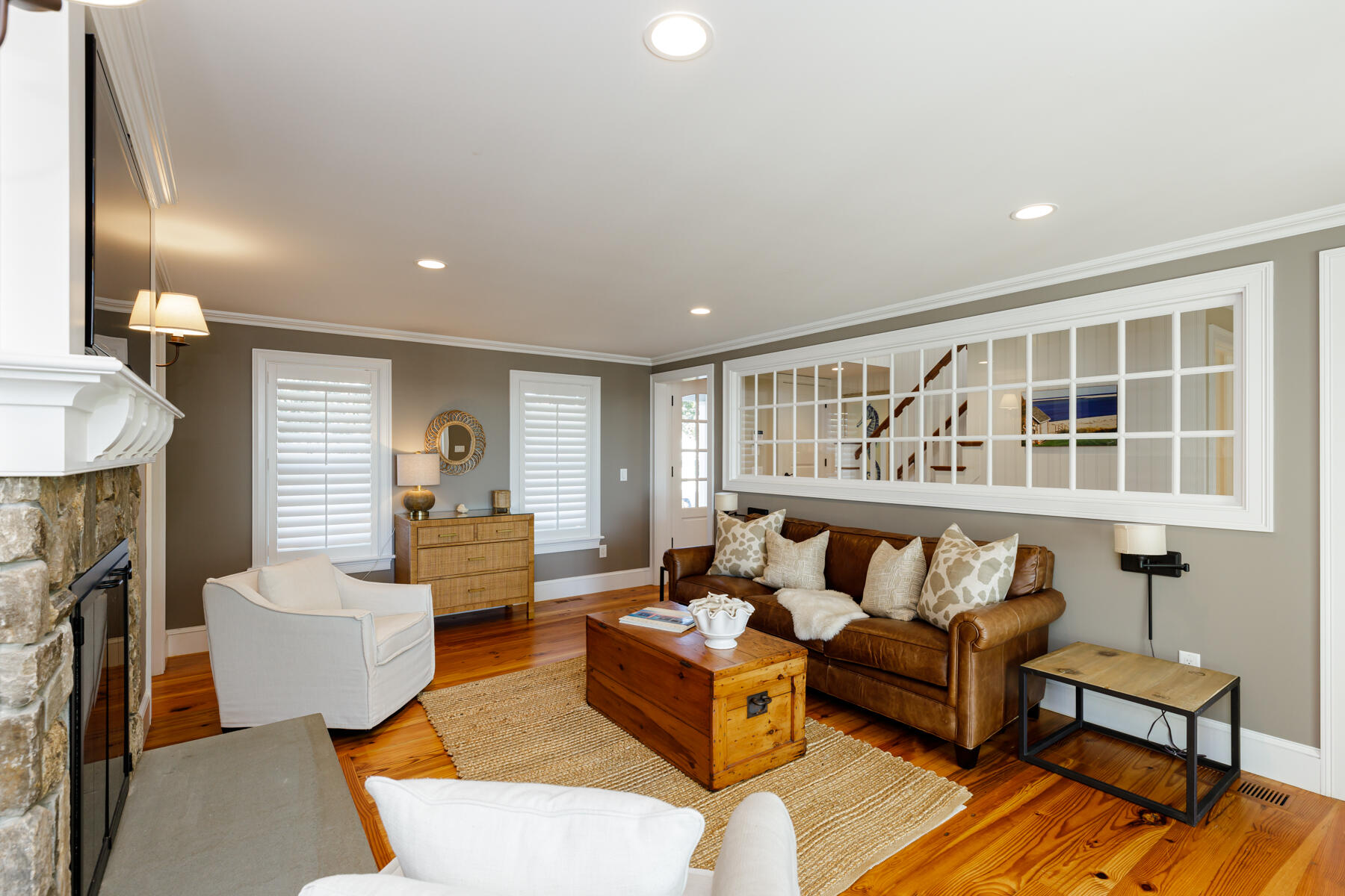 27 Patterson Road Chatham, MA 02633 - Photo 27 of 68 a living room with furniture and a fireplace