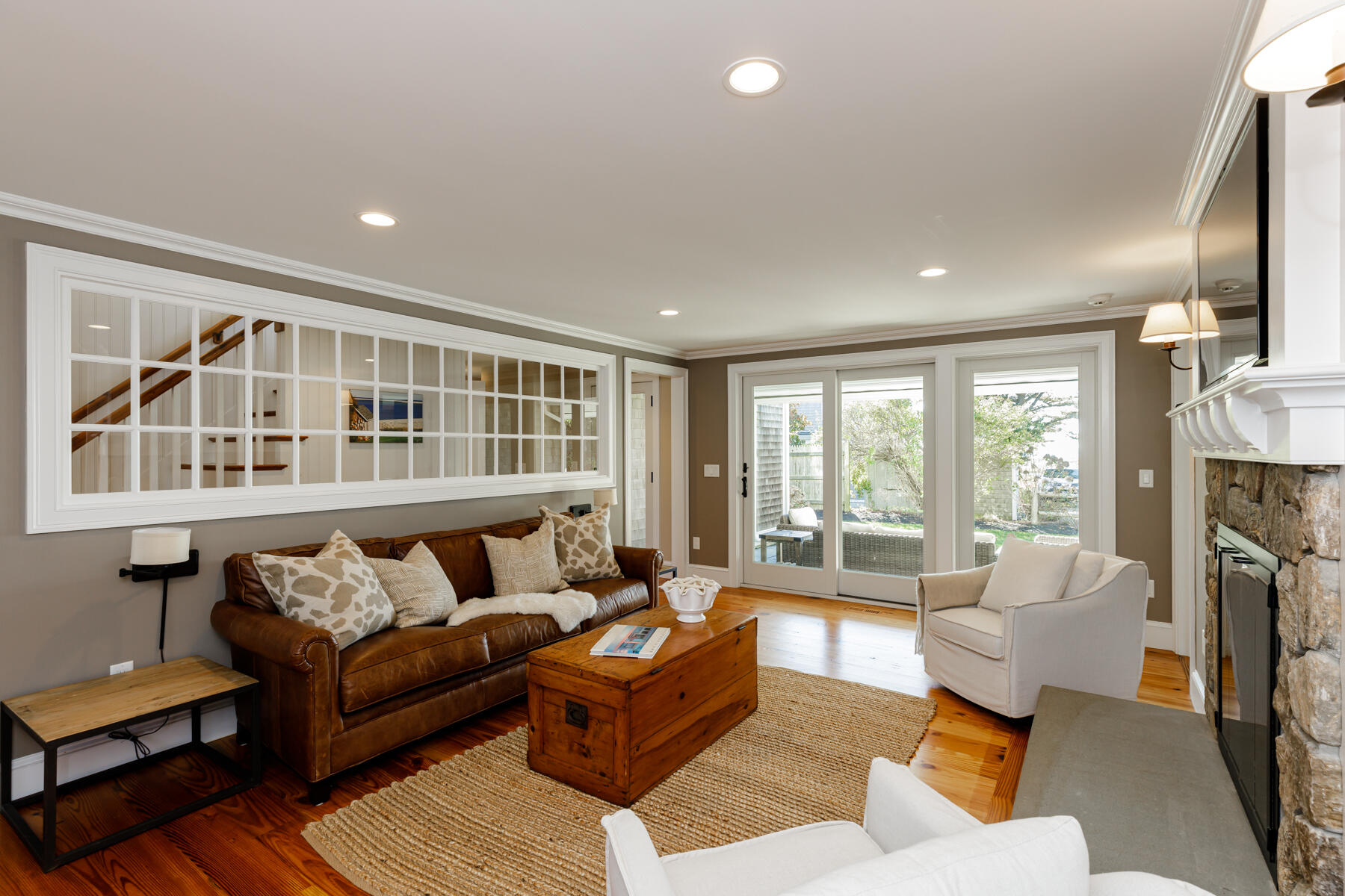 27 Patterson Road Chatham, MA 02633 - Photo 29 of 68 a living room with furniture and a fireplace