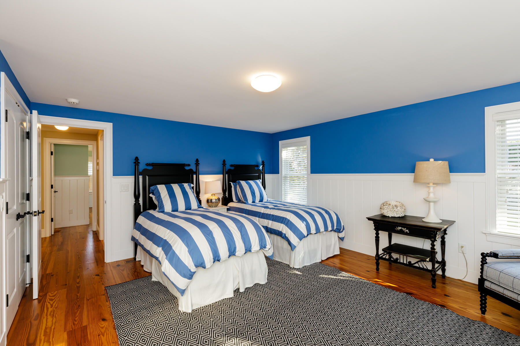 27 Patterson Road Chatham, MA 02633 - Photo 43 of 68 a bedroom with furniture and a lamp