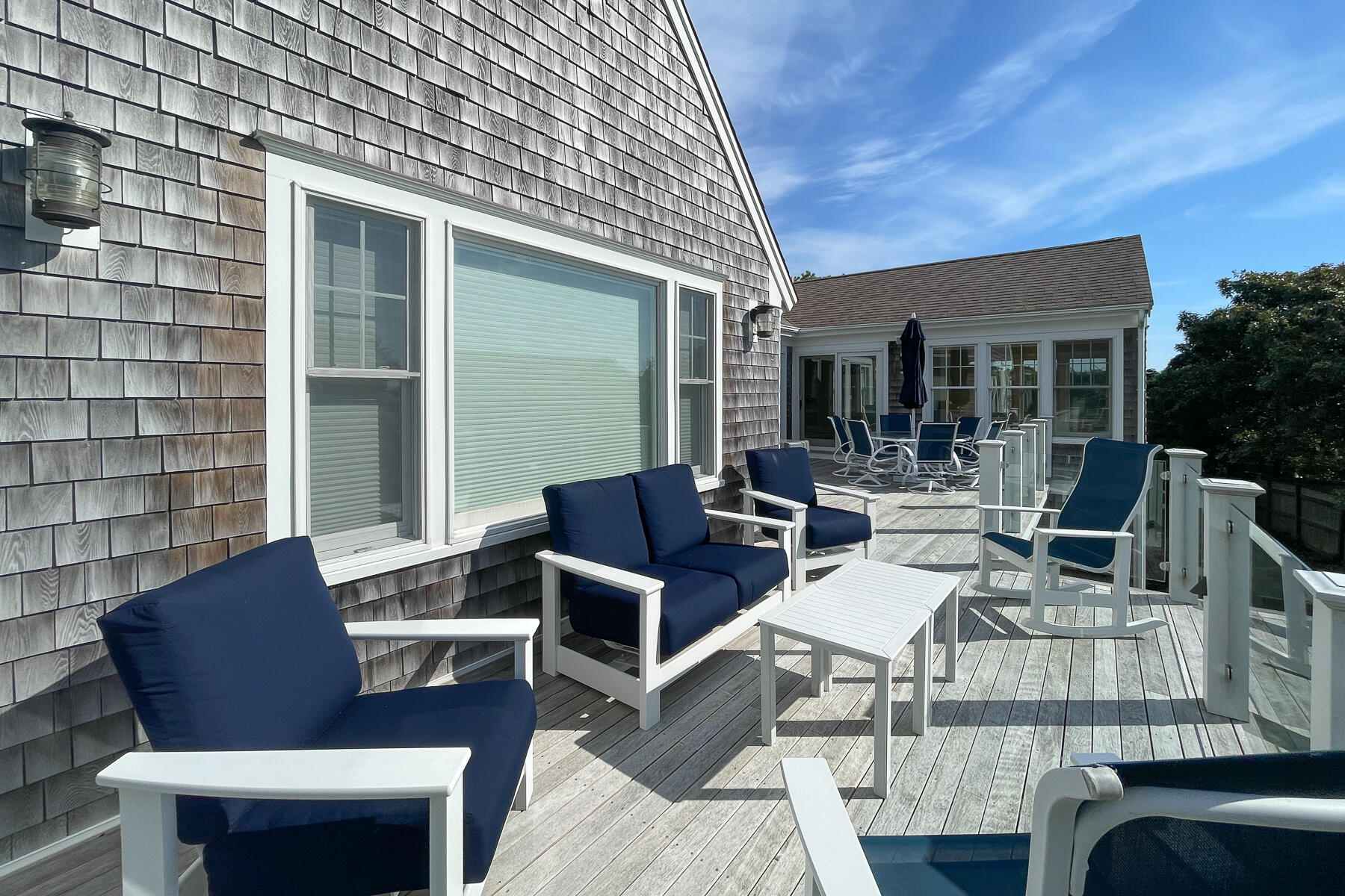 27 Patterson Road Chatham, MA 02633 - Photo 48 of 68 a view of a patio with couches table and chairs and potted plants