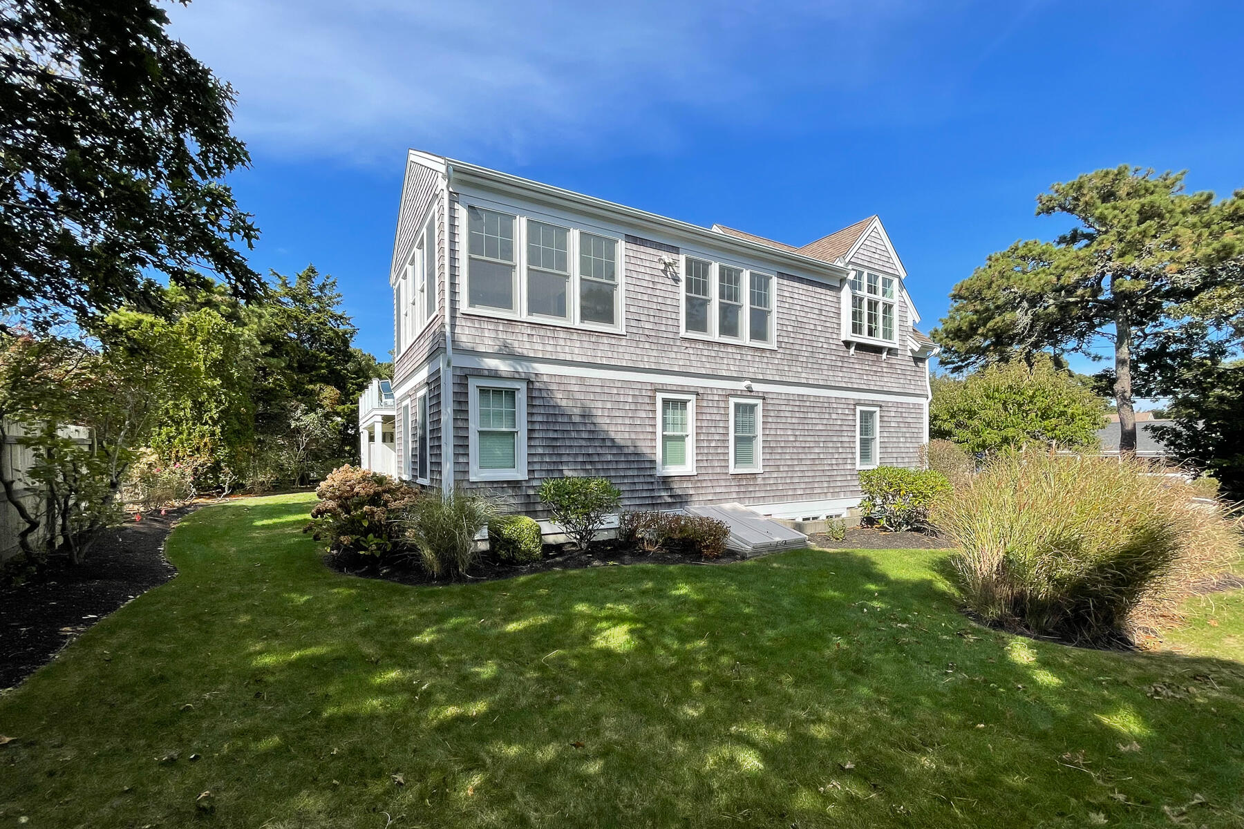 27 Patterson Road Chatham, MA 02633 - Photo 49 of 68 a front view of a house with a garden