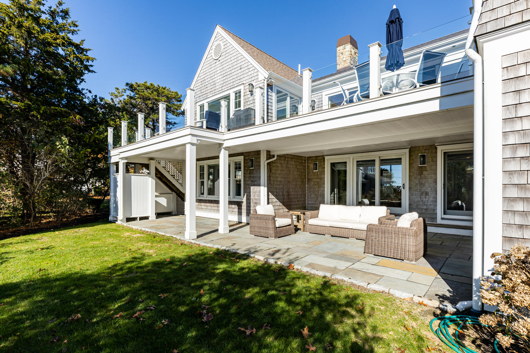 27 Patterson Road Chatham, MA 02633 - Photo 50 of 68 a view of a house with a yard and sitting area