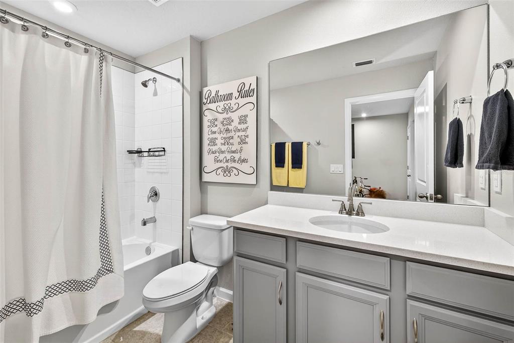 25993 Woven Wicker Bend Lutz, FL 33559 - Photo 11 of 45 a bathroom with a sink toilet and shower