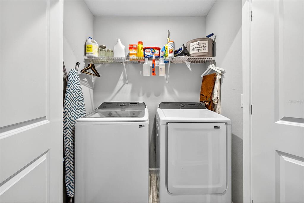 25993 Woven Wicker Bend Lutz, FL 33559 - Photo 12 of 45 a utility room with dryer and washer