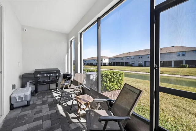 a view of a chairs and table in the patio