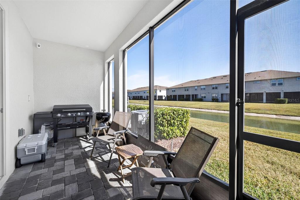 25993 Woven Wicker Bend Lutz, FL 33559 - Photo 14 of 45 a view of a chairs and table in the patio