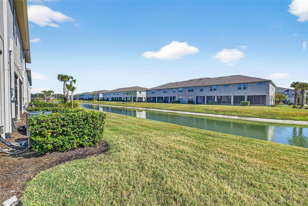 25993 Woven Wicker Bend Lutz, FL 33559 - Photo 15 of 45 a view of a house with a yard and a swimming pool
