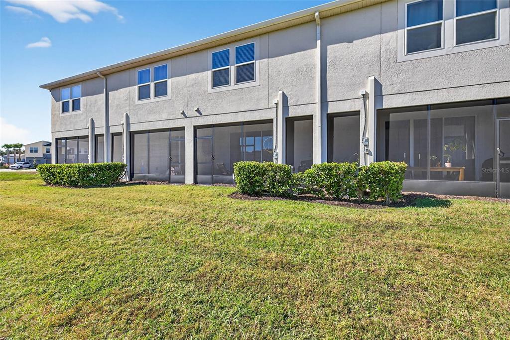 25993 Woven Wicker Bend Lutz, FL 33559 - Photo 17 of 45 a front view of a house with garden