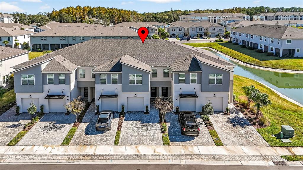 25993 Woven Wicker Bend Lutz, FL 33559 - Photo 18 of 45 a view of a house with a swimming pool
