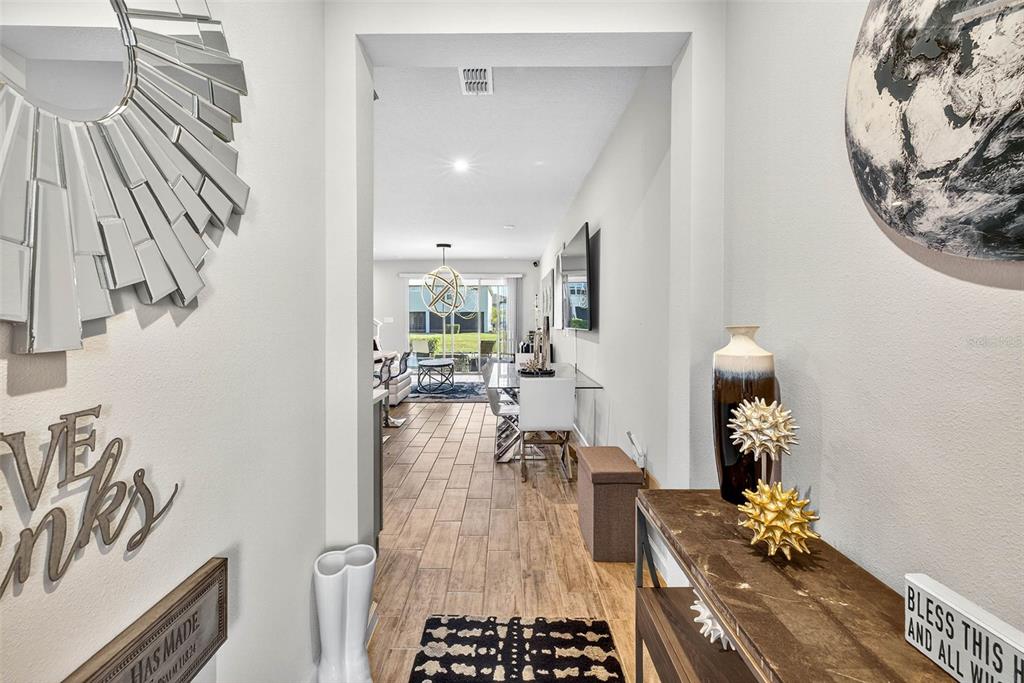 25993 Woven Wicker Bend Lutz, FL 33559 - Photo 23 of 45 a dining room with wooden floor