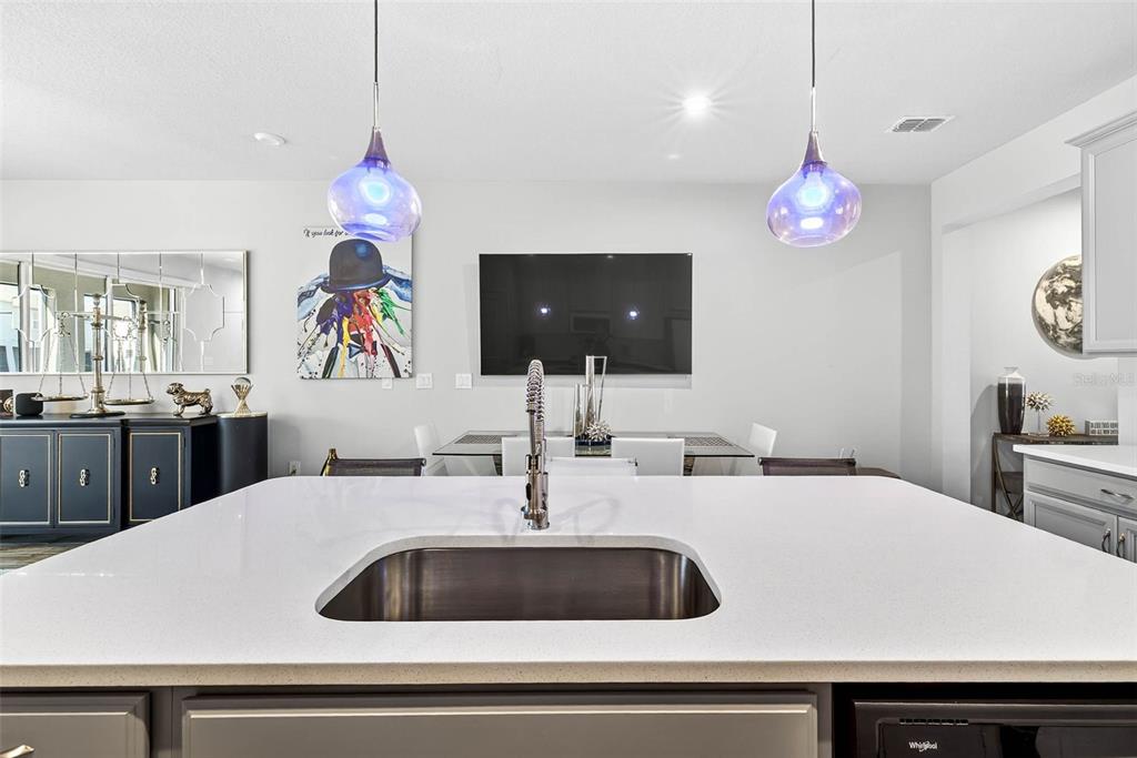 25993 Woven Wicker Bend Lutz, FL 33559 - Photo 27 of 45 a kitchen with a sink and a chandelier