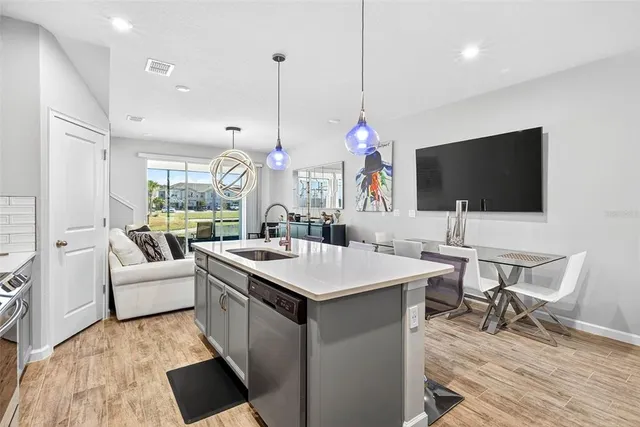 a view of kitchen with a table and chairs