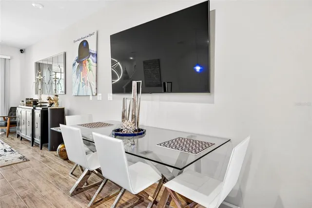 a kitchen with a table and chairs