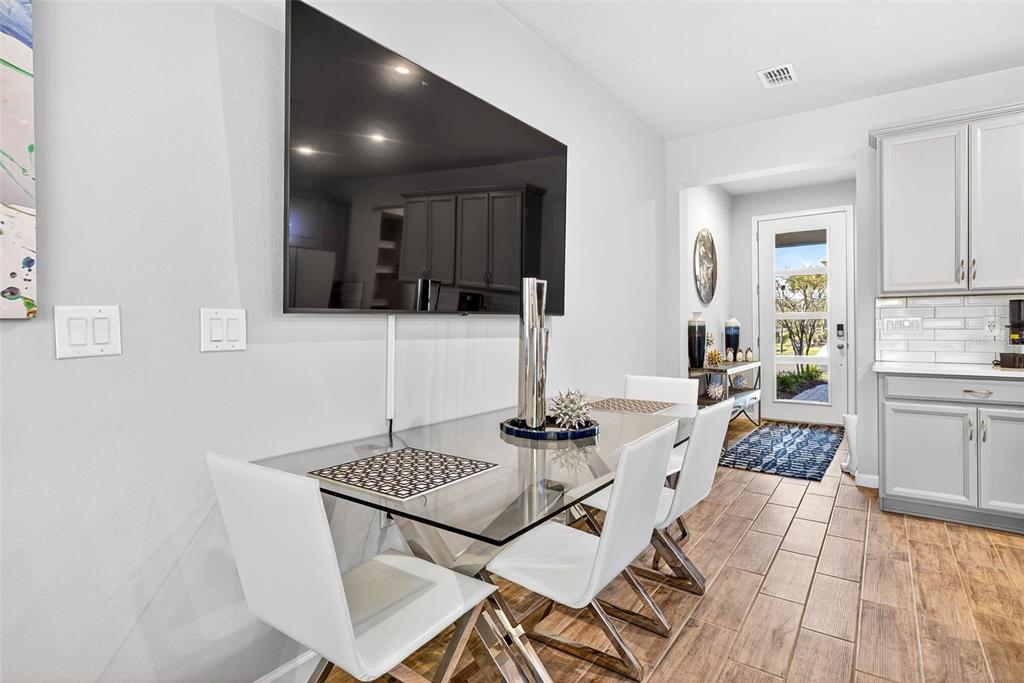 25993 Woven Wicker Bend Lutz, FL 33559 - Photo 3 of 45 a kitchen with a sink and stove