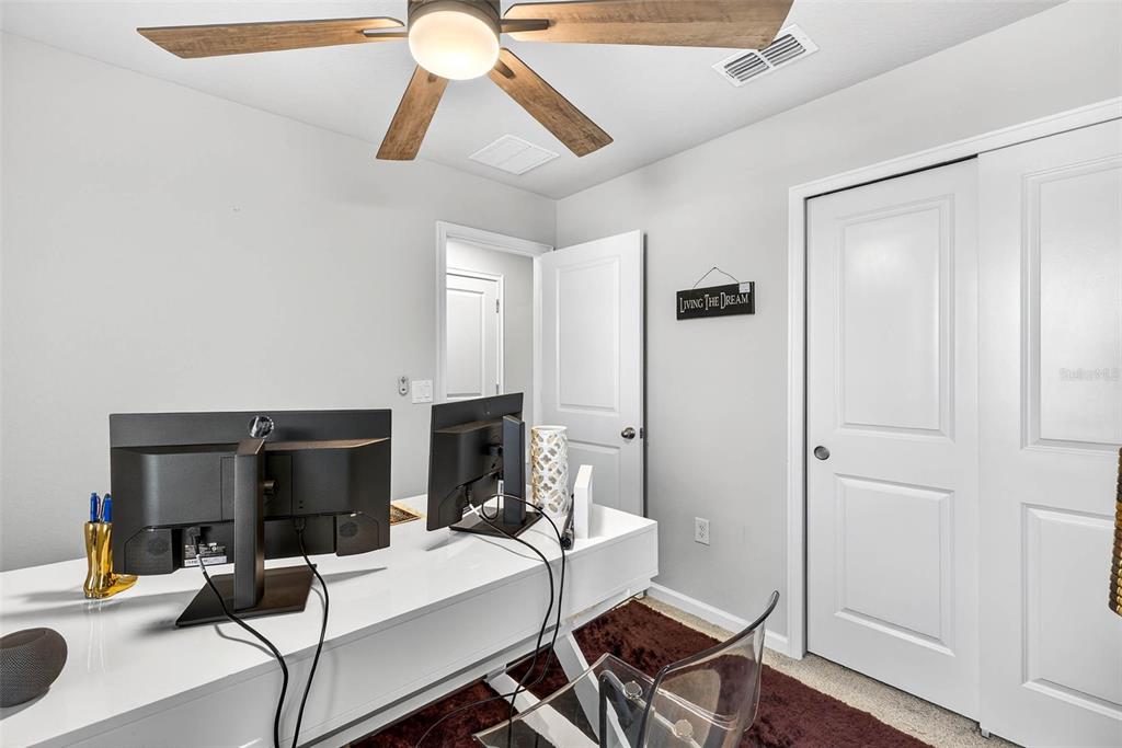 25993 Woven Wicker Bend Lutz, FL 33559 - Photo 39 of 45 a view of a livingroom with furniture and a flat screen tv