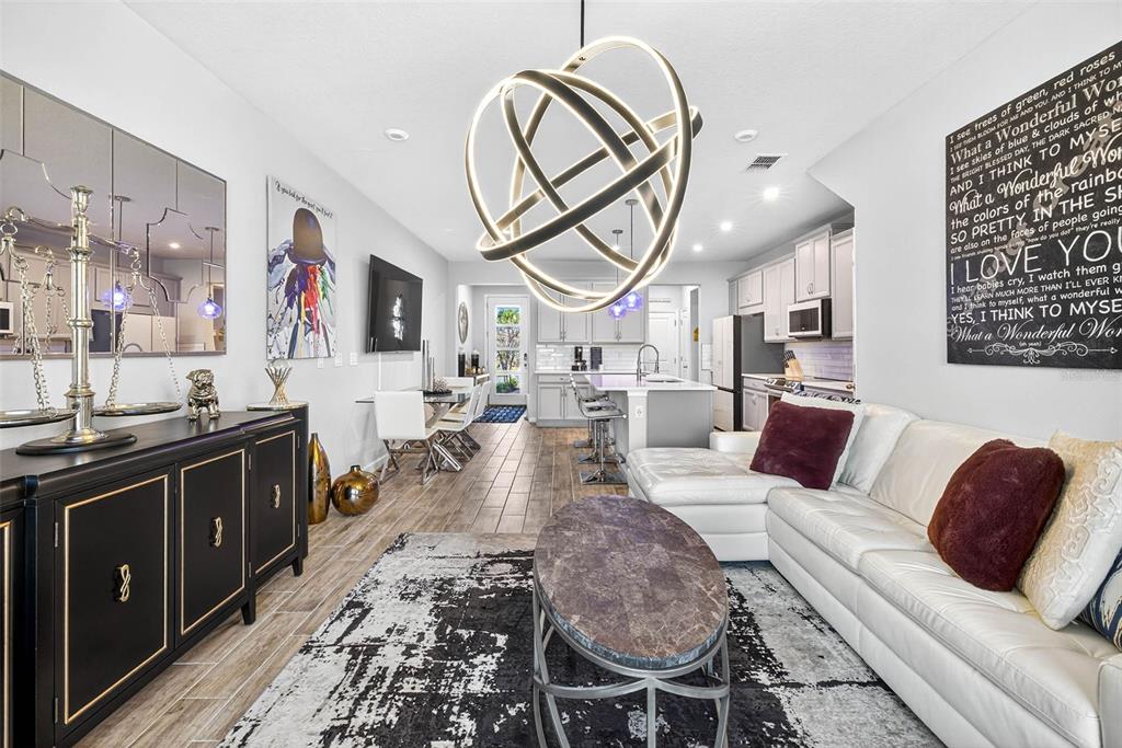 25993 Woven Wicker Bend Lutz, FL 33559 - Photo 5 of 45 a living room with furniture a large window and stainless steel appliances