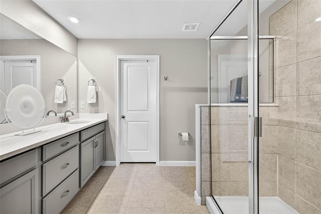 25993 Woven Wicker Bend Lutz, FL 33559 - Photo 7 of 45 a bathroom with a double vanity sink mirror and double