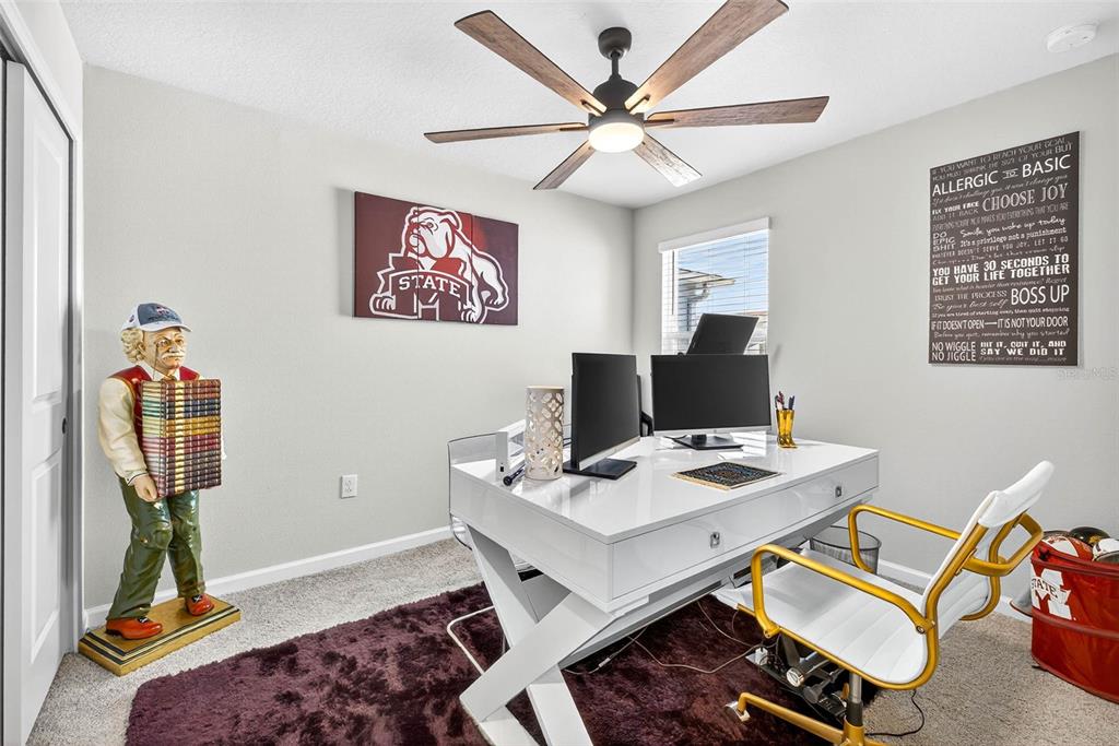 25993 Woven Wicker Bend Lutz, FL 33559 - Photo 9 of 45 a workspace with furniture and gym equipment