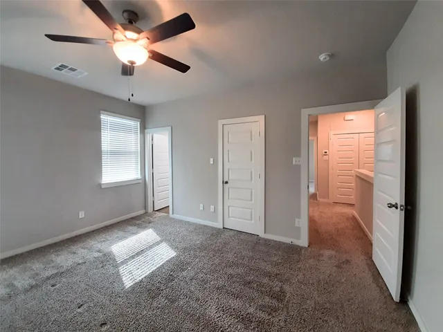 a view of livingroom with a ceiling fan and window