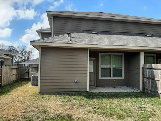 a house view with a backyard space