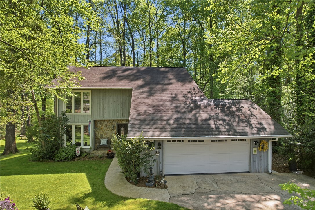 110 Shaftsbury Road Clemson, SC 29631 - Photo 1 of 38 This charming home is nestled amongst mature trees, offering a serene and private living environment.
