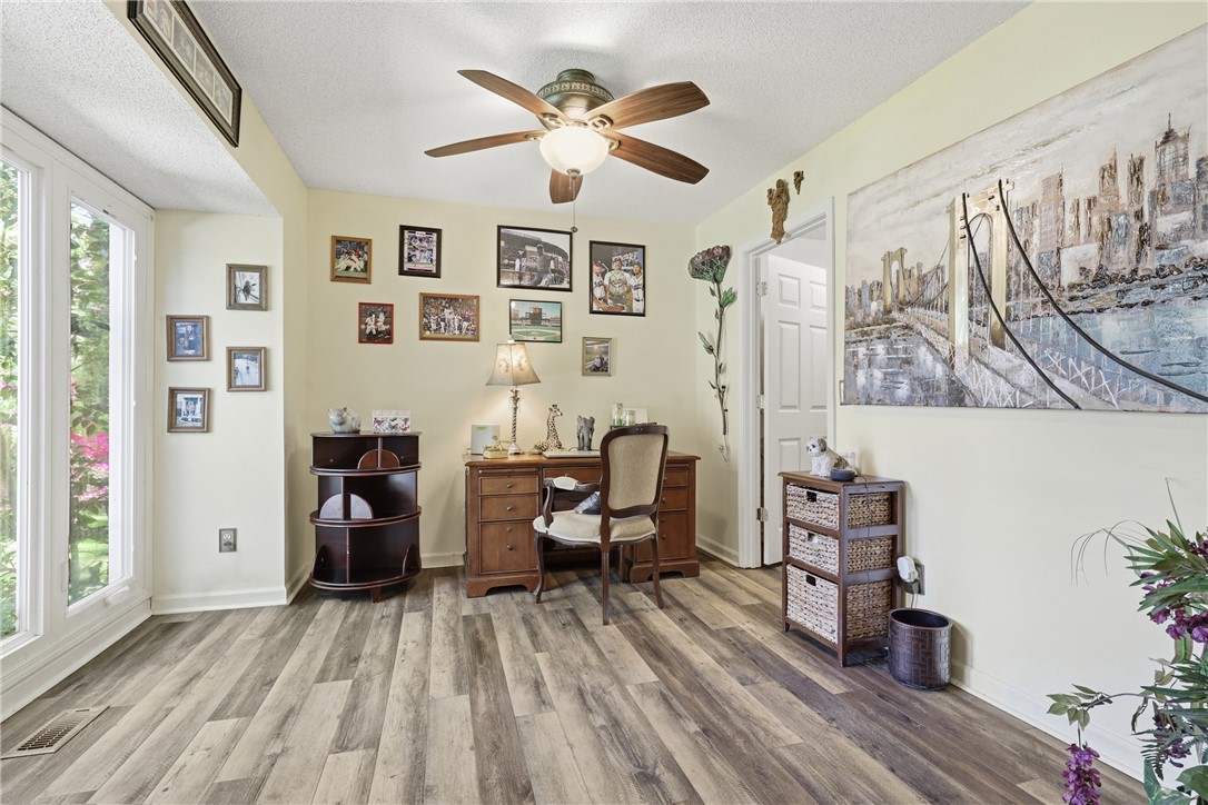 110 Shaftsbury Road Clemson, SC 29631 - Photo 11 of 38 This bright and inviting room features expansive windows, a stylish ceiling fan, and durable wood flooring and ensuite.