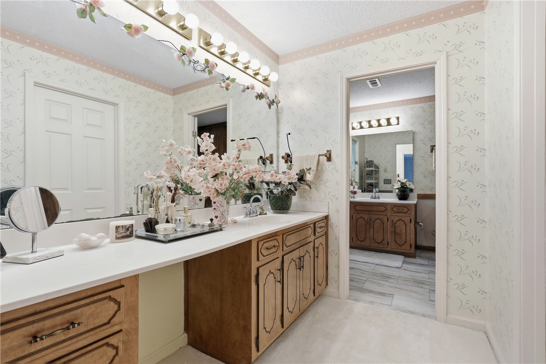 110 Shaftsbury Road Clemson, SC 29631 - Photo 15 of 38 This spacious primary bathroom features ample counter space, dual vanities, and bright vanity lighting.