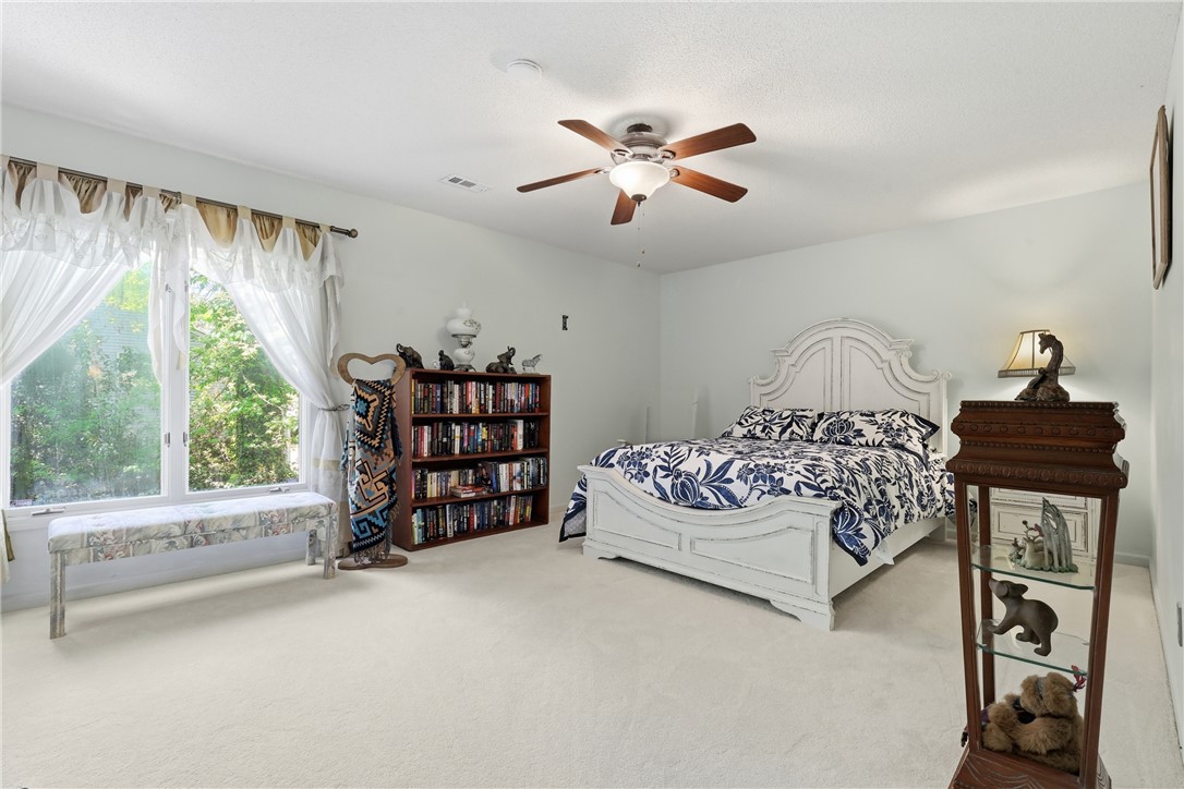 110 Shaftsbury Road Clemson, SC 29631 - Photo 17 of 38 This airy bedroom features abundant natural light, offering a tranquil retreat with soft carpet.
