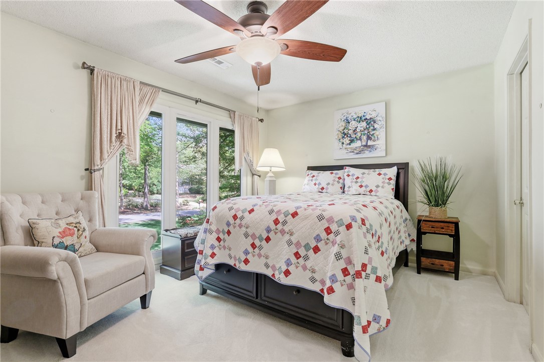 110 Shaftsbury Road Clemson, SC 29631 - Photo 19 of 38 This serene bedroom offers a private outdoor view and convenient direct access to the yard.