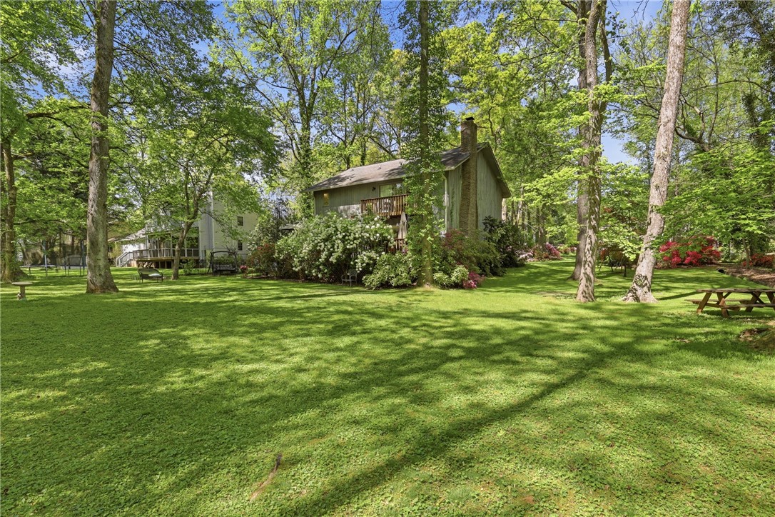 110 Shaftsbury Road Clemson, SC 29631 - Photo 26 of 38 Lush green lawn provides a serene backdrop to this charming, secluded home.