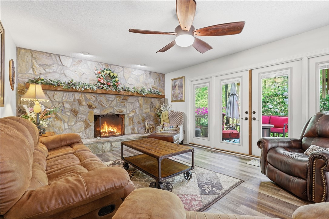 110 Shaftsbury Road Clemson, SC 29631 - Photo 4 of 38 This inviting living space features a cozy fireplace and convenient outdoor access.
