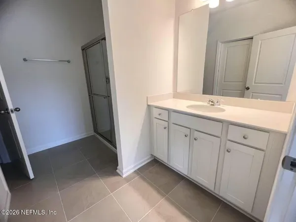 a view of a storage and utility room with closet