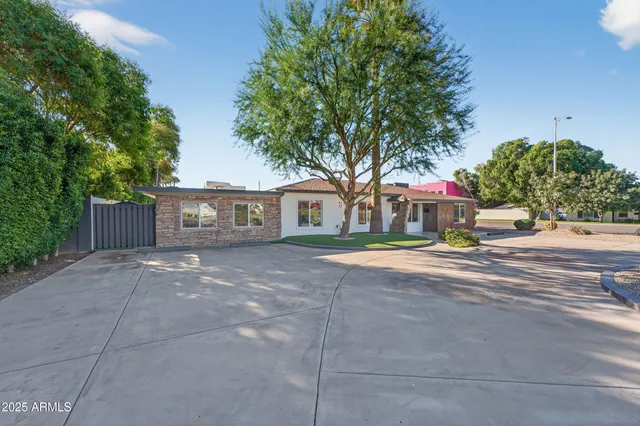 a view of street with houses and trees