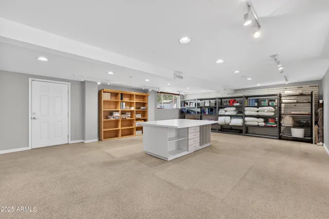 a view of a room with lots of furniture and lots of furniture