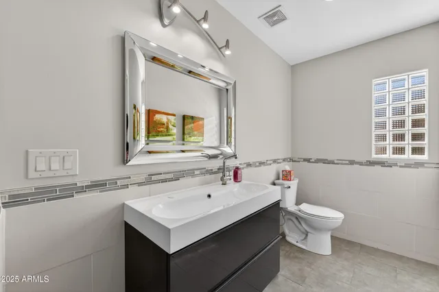 a bathroom with a sink and a toilet