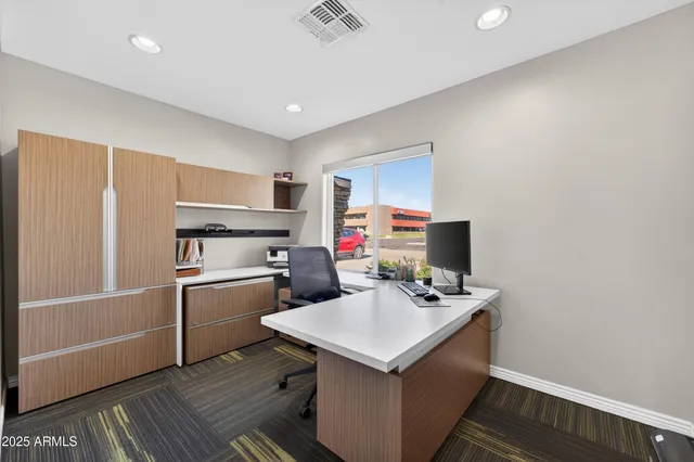 a kitchen that has a sink and a microwave in it