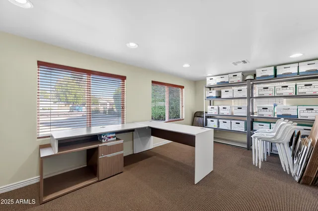 a large living room with furniture and a window