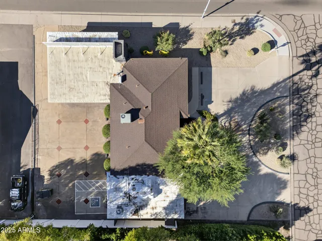 an aerial view of a house with a yard