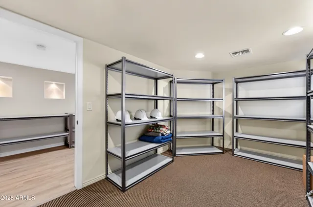 a empty room with racks on the wall