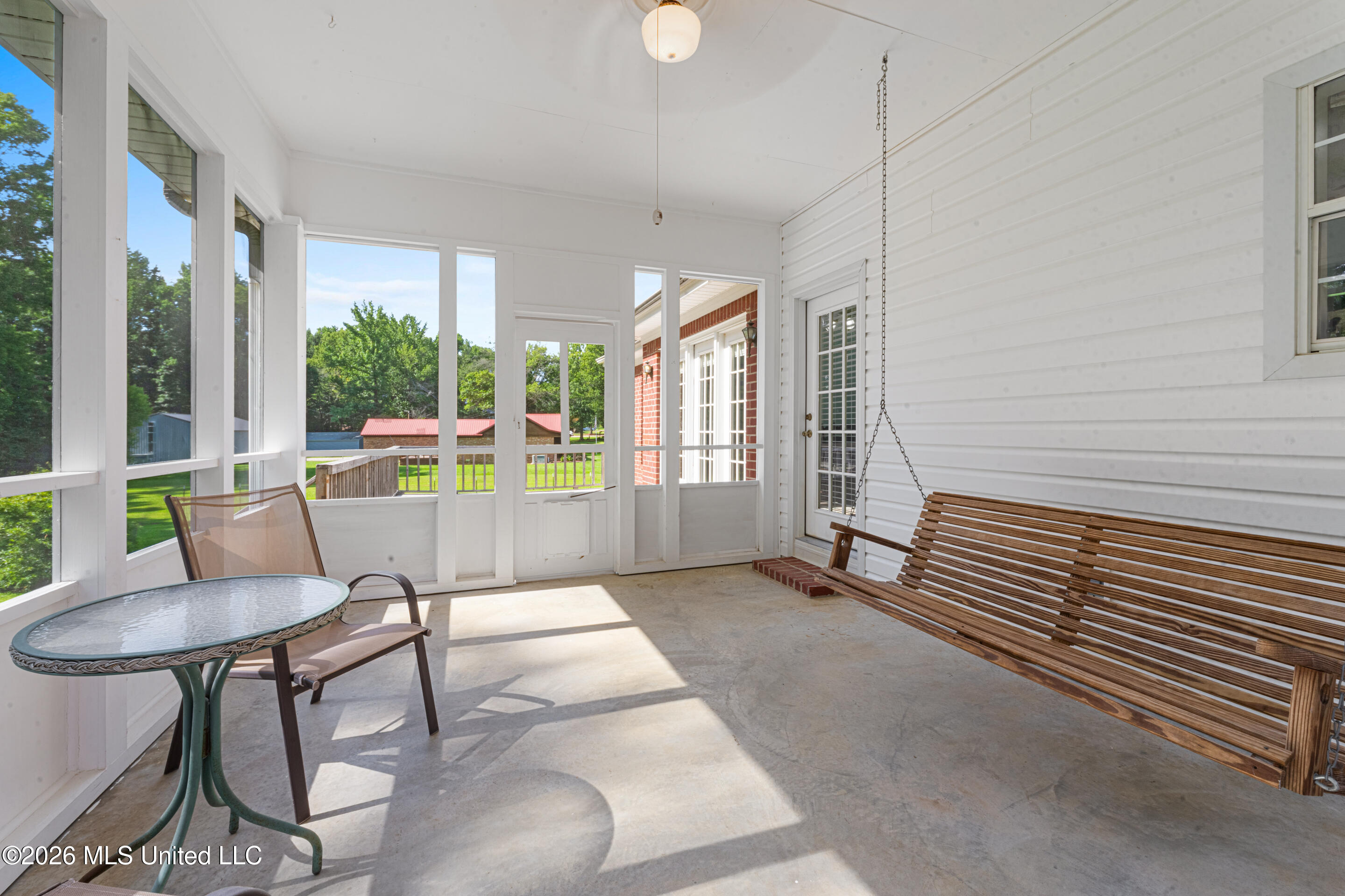 127 West Sweetwater Road Byhalia, MS 38611 - Photo 18 of 25 Screened-in back porch with swing