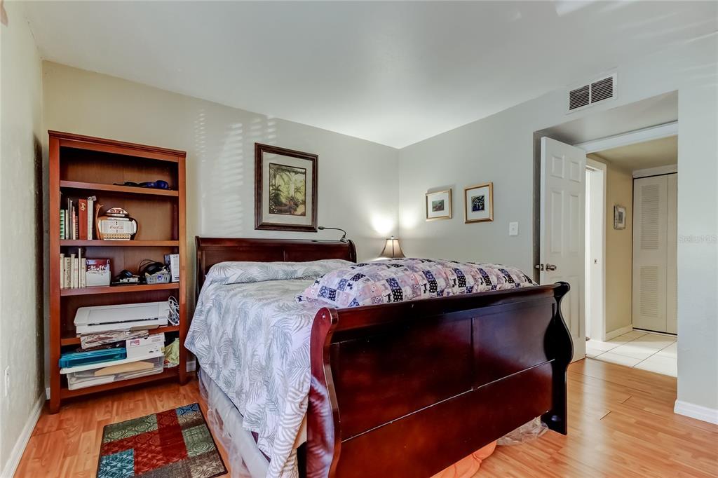 3650 41st Way South, Unit A St. Petersburg, FL 33711 - Photo 16 of 35 a bed room with a bed and a painting on the wall