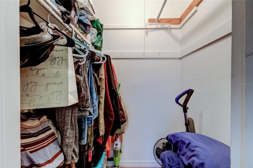 3650 41st Way South, Unit A St. Petersburg, FL 33711 - Photo 17 of 35 a view of walk in closet with clothes and shoes