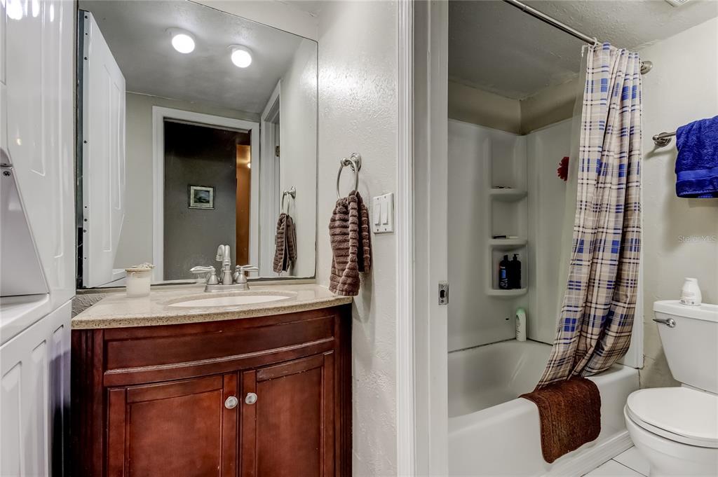 3650 41st Way South, Unit A St. Petersburg, FL 33711 - Photo 18 of 35 a bathroom with a sink a toilet and shower