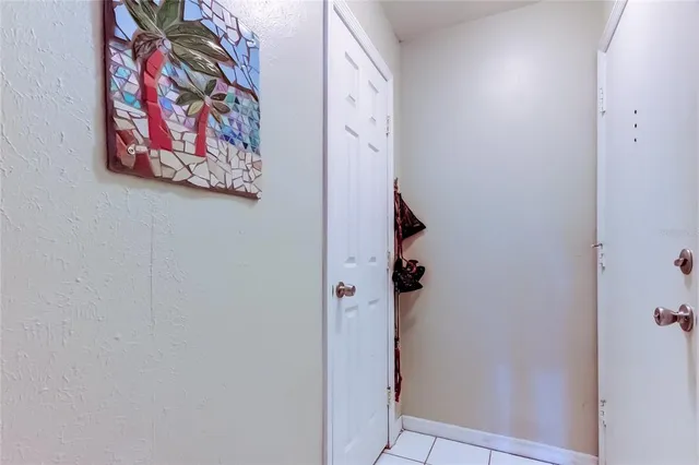 a bathroom with a door and a shower curtain