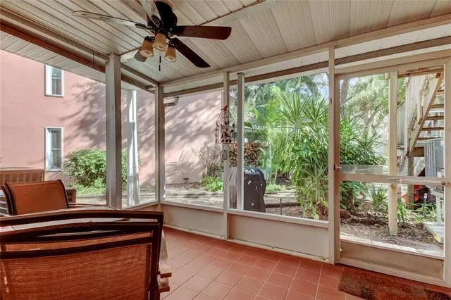 a view of a porch with furniture and front door
