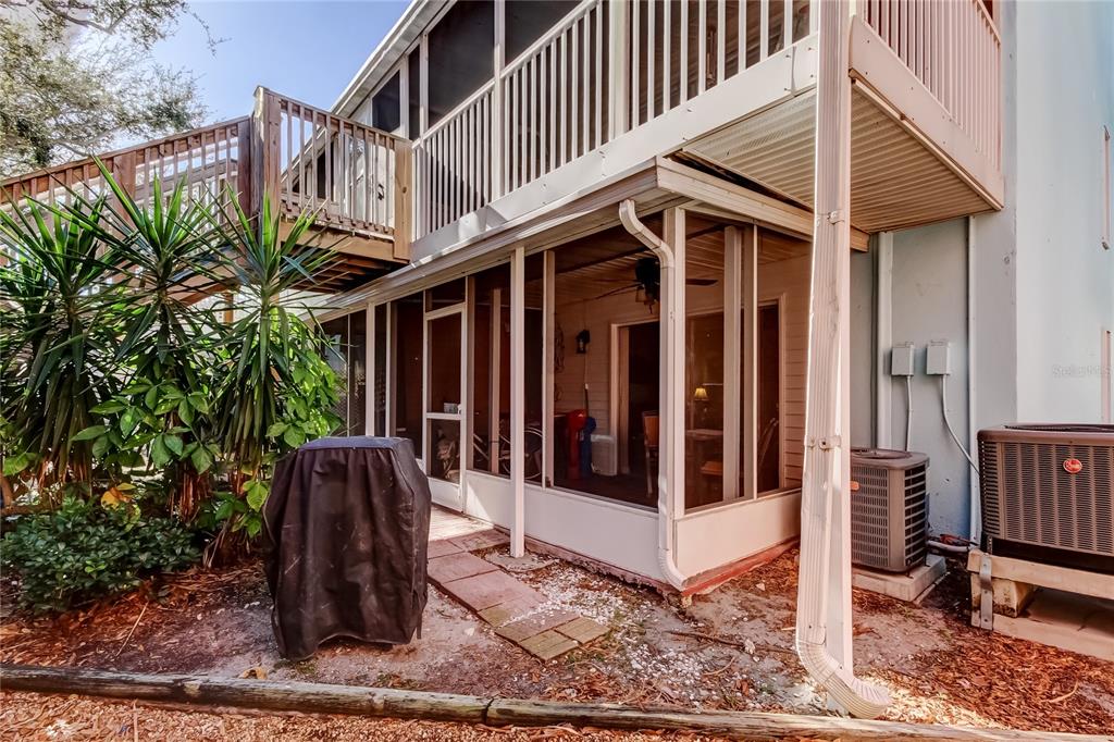 3650 41st Way South, Unit A St. Petersburg, FL 33711 - Photo 26 of 35 a view of a white house with many windows and plants