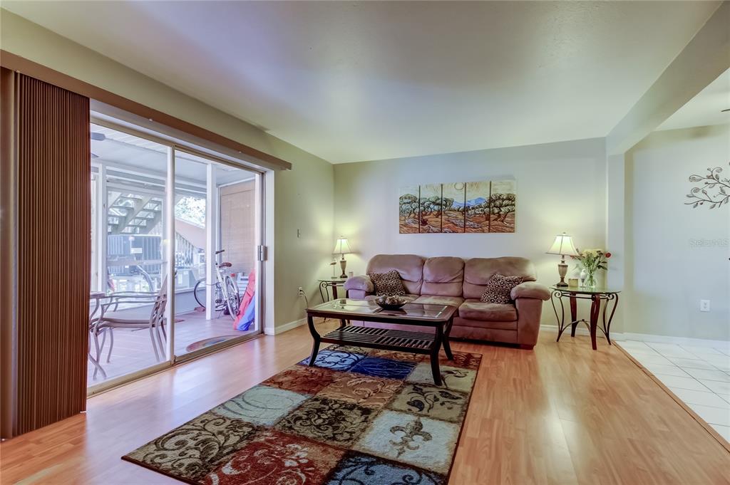 3650 41st Way South, Unit A St. Petersburg, FL 33711 - Photo 4 of 35 a living room with furniture and wooden floor