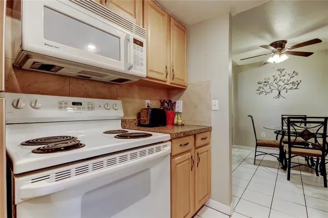 a kitchen with stainless steel appliances granite countertop a stove and a cabinets