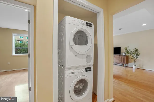 a view of a hallway with washer and dryer