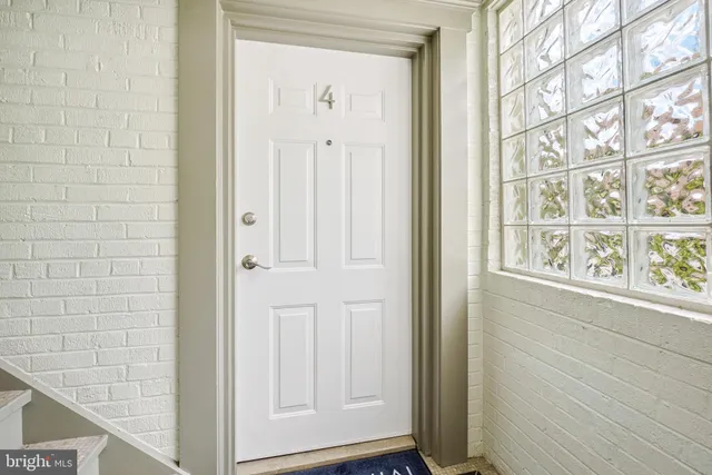 a view of front door with wooden floor